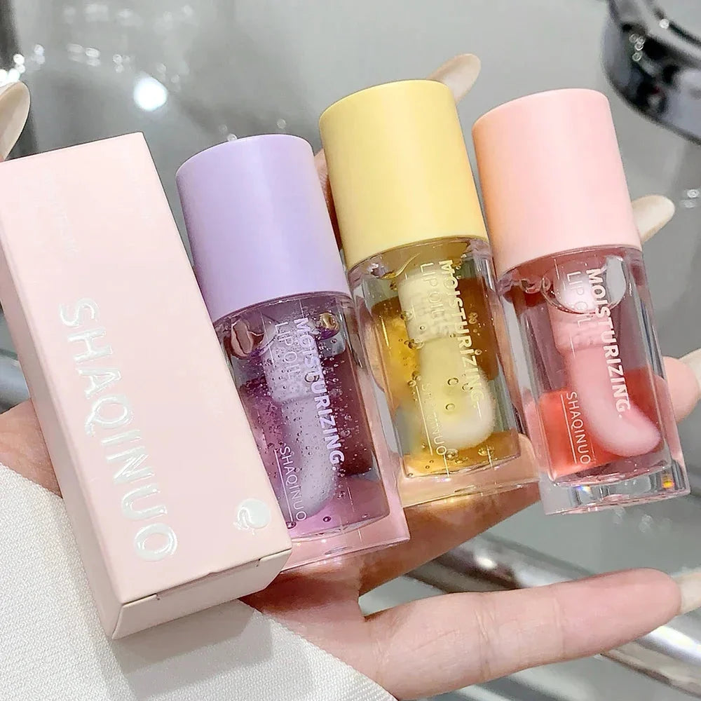 Transparent lip oil 3.2 g with four scent variants